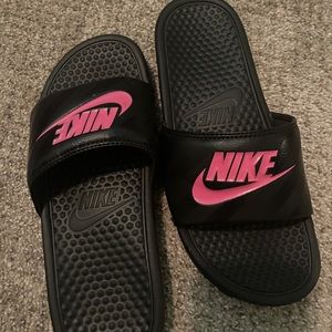 Black and pink Nike slides